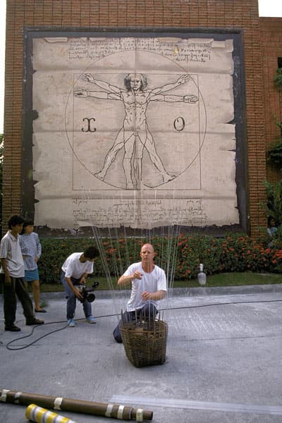 Neil working with glass tube and found objects in workshop outside Art Lab, Manila.